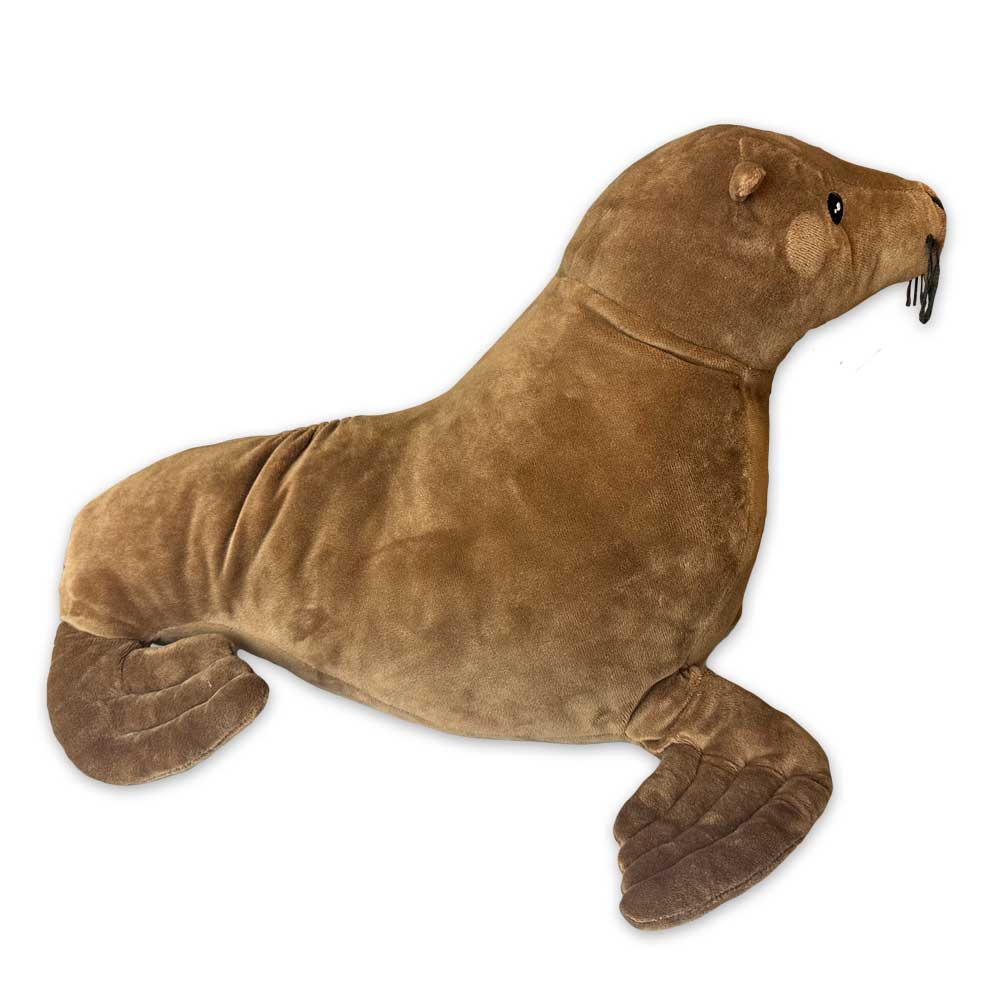 The Earth Pal Sea Lion Plush is an eco-friendly plush toy shaped like a brown seal with flippers, small ears, black eyes, and stitched whiskers, shown lying on a white background.