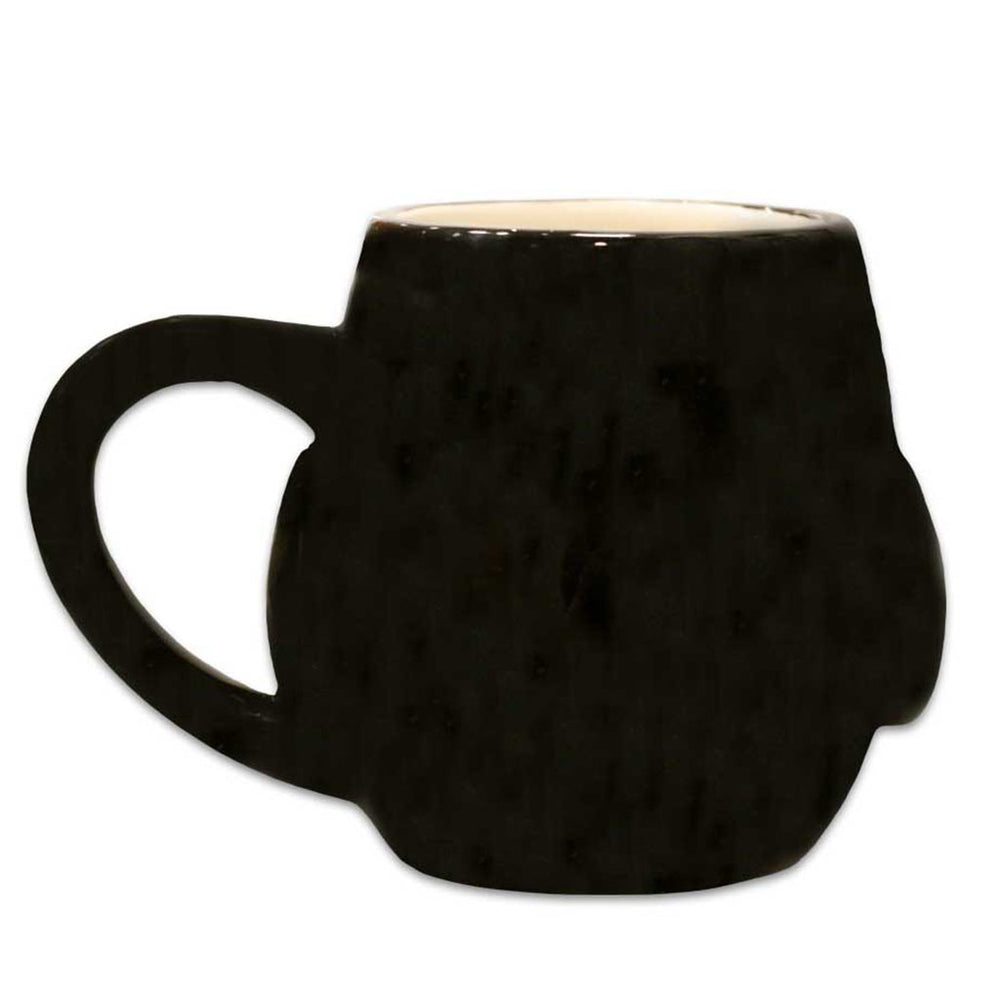 The Penguin 3D Mug features a black ceramic exterior shaped like a clenched fist, with a thumb-and-palm handle. Its light cream interior contrasts beautifully with the dark outside, reminiscent of collectible Shedd Aquarium mugs.