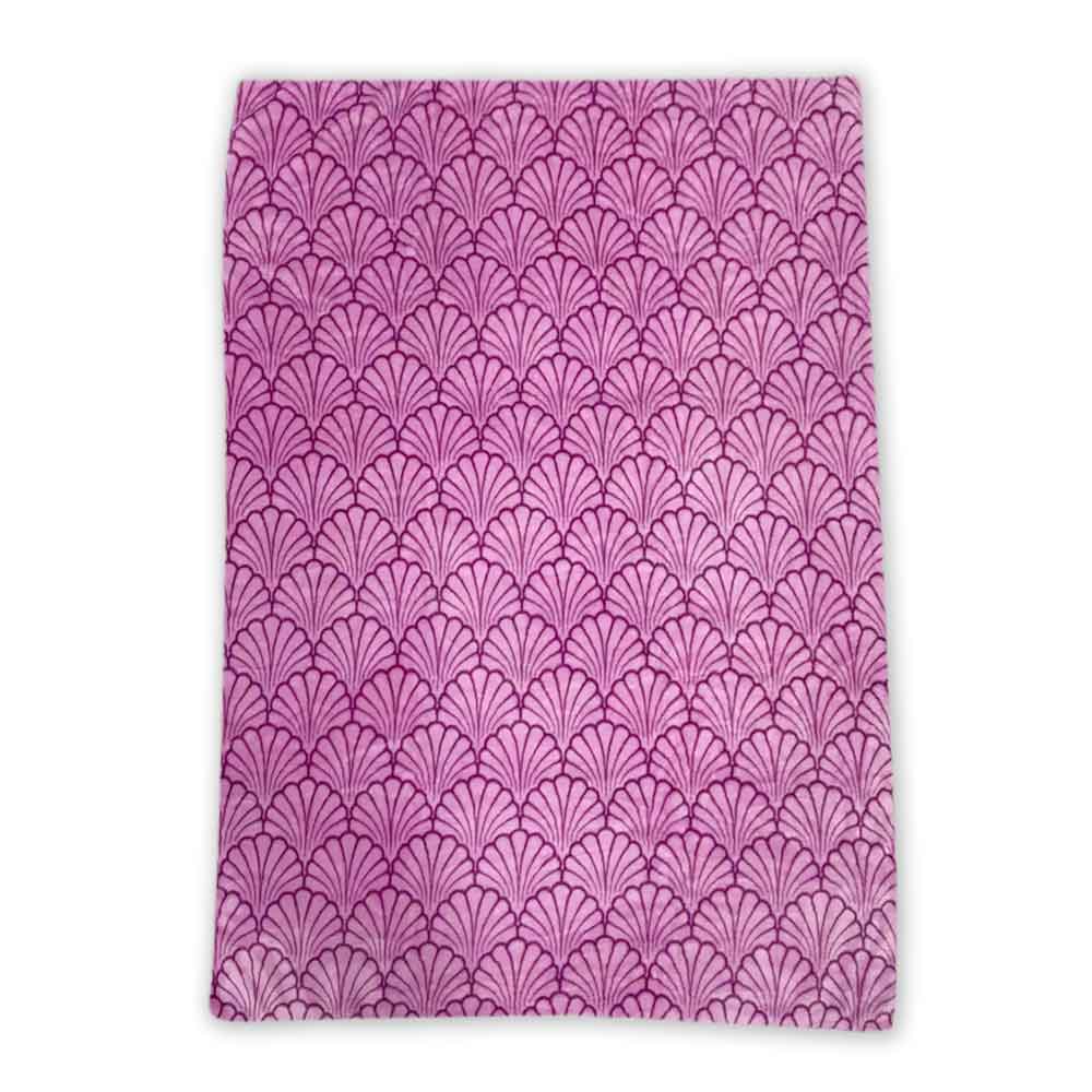The Shell Plush Blanket Bag Combo is a soft travel blanket in pink featuring a repeating fan-shaped scallop pattern with darker pink lines on a white background.