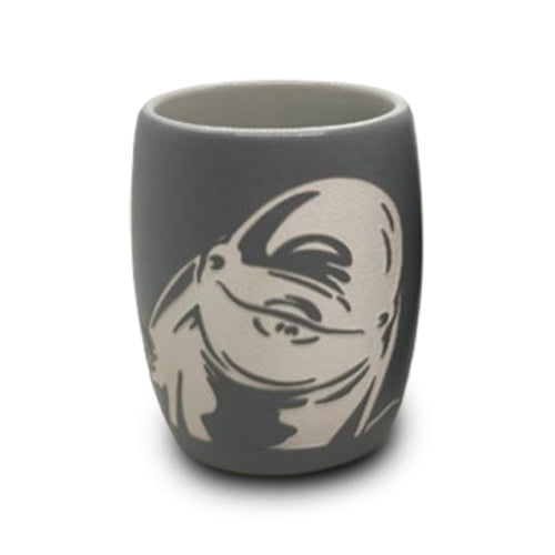 A gray shot glass featuring an etched beluga design—a playful tribute to aquatic conservation initiatives inspired by renowned institutions like Shedd Aquarium.