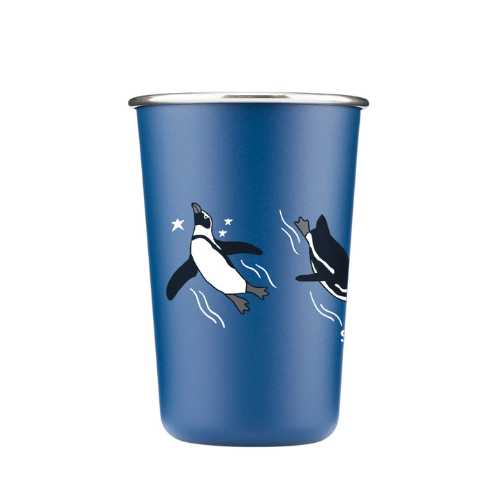 The Shedd Aquarium Red White & Ocean Blue Stars Pint Cup is eco-friendly, features two swimming penguins with white stars and a metallic rim—ideal for marine life lovers and aquarium fans.