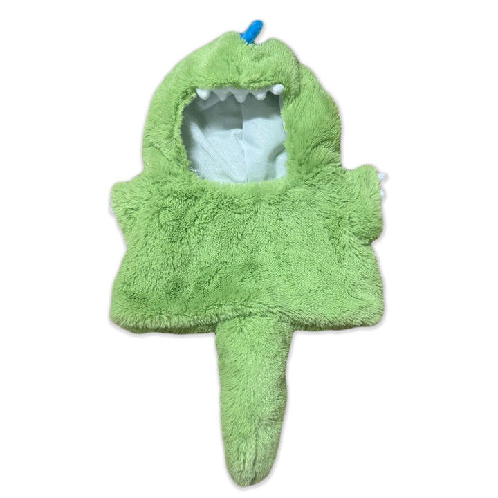 A fluffy green costume called the Plushy’s Closet Dino Outfit, featuring a hood with white felt teeth, a blue spike on top, small arms, and a tail—all laid flat on a white background. This charming plush animal accessory adds playful prehistoric style to any dress-up collection.