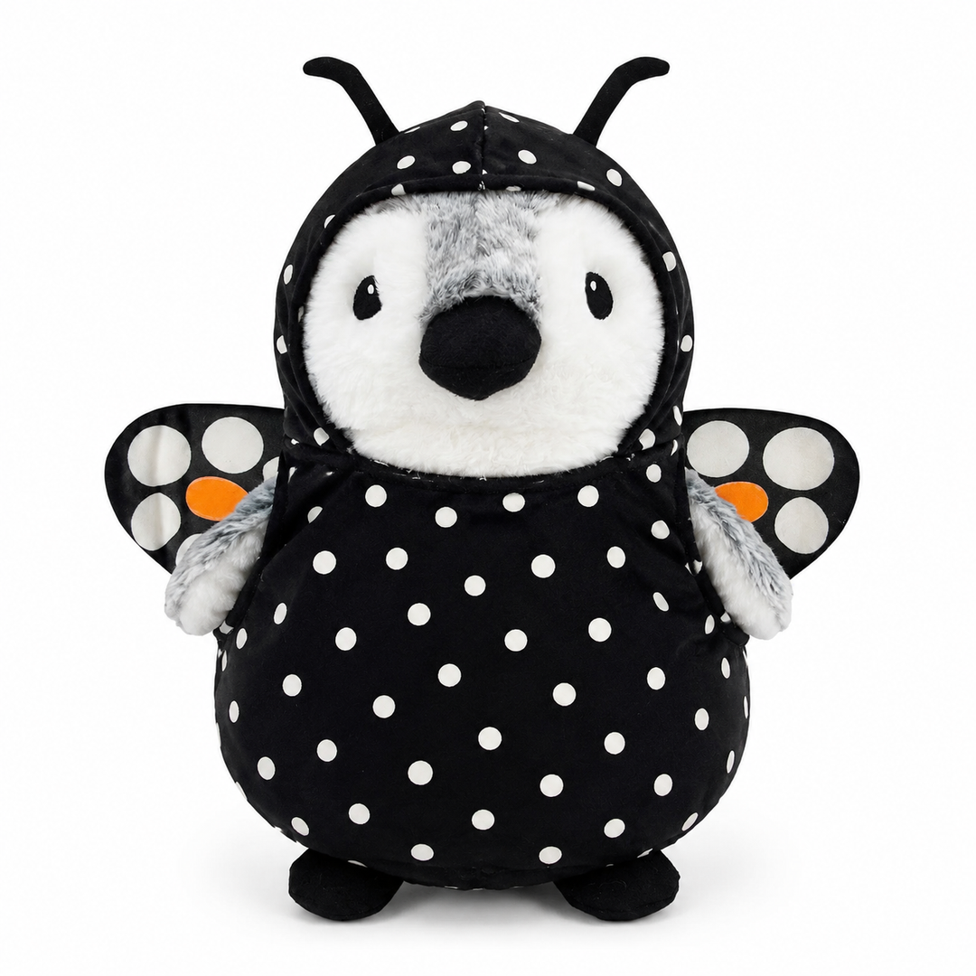 Wearing Plushy’s Closet Butterfly Outfit and fueled by imagination, a plush penguin stands ready for whimsical adventures—dressed in a vibrant butterfly costume with wings, antennae, and colorful accents—all set against a white background.