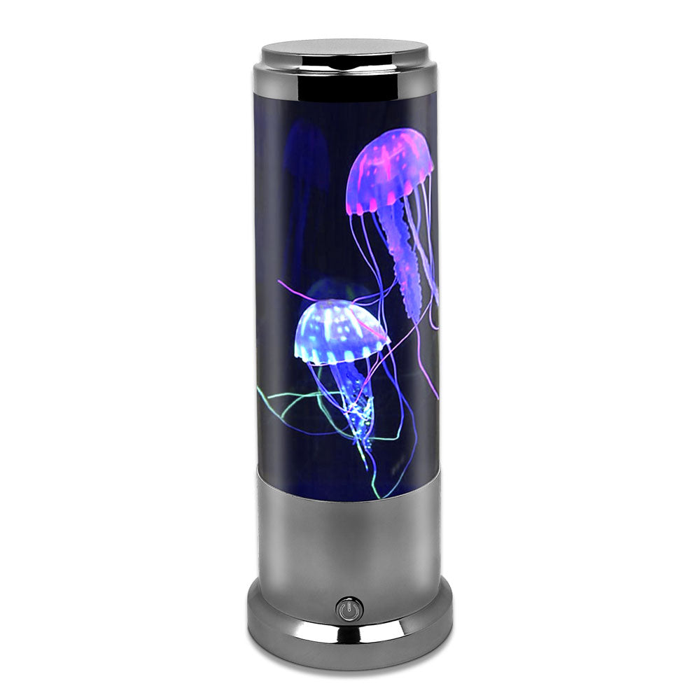 The Genius at Play Metallic Jellyfish Lamp features glowing, colorful artificial jellyfish illuminated by blue, purple, and pink hues against a black backdrop with a metallic base—perfect as an underwater-themed accent for any space.