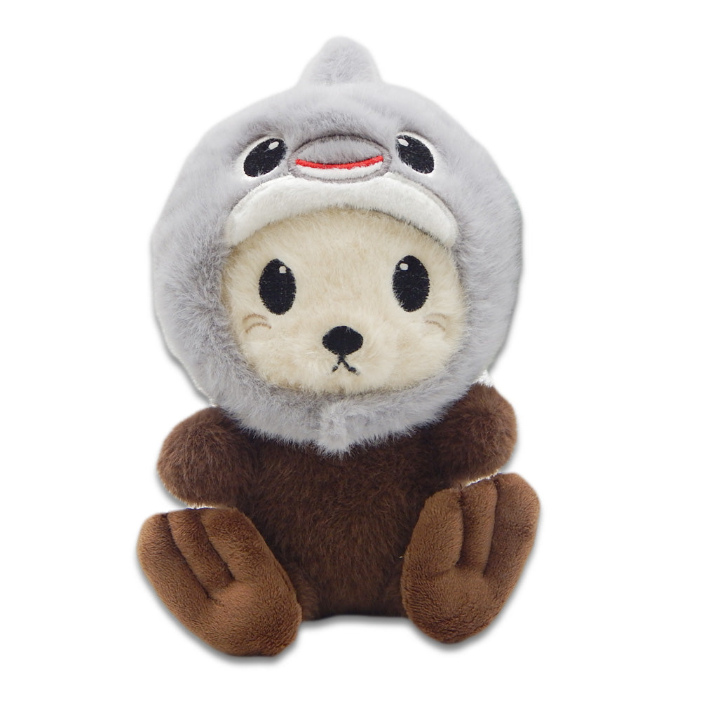 The Sea Otter with Dolphin Cap Cutie Plush features a brown sea otter wearing a playful dolphin cap, its body and paws visible. This cute plush is fun and educational for all ages, shown on a plain white background.