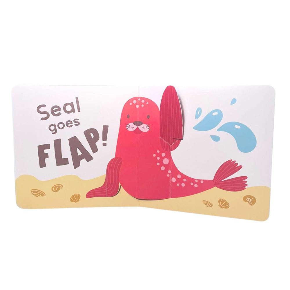 Mini Pops: In the Sea! is a mini pop-up board book featuring a pink seal on sand with shells, raising a flipper and splashing water. The text reads “Seal goes FLAP!”—a perfect sea animals book for babies and toddlers.