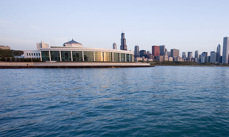 City skyline with a building by the waterfront on a clear day