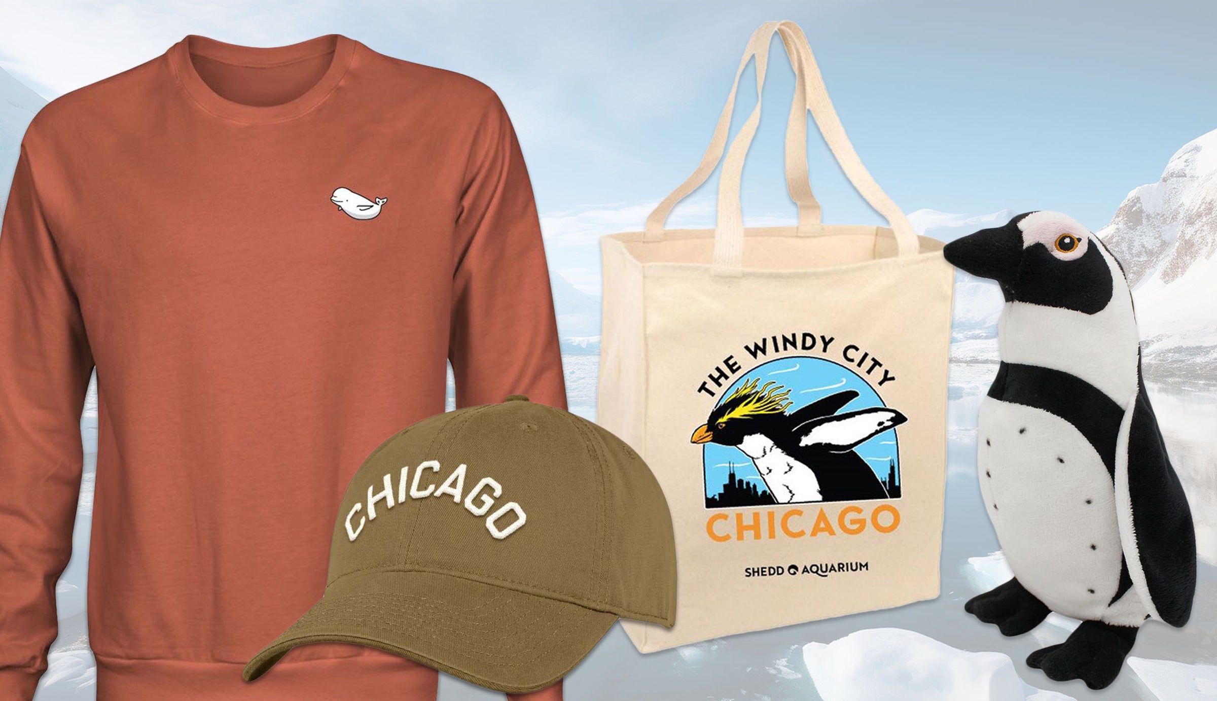 Collection of Chicago-themed merchandise including a sweatshirt, cap, tote bag, and plush penguin on a snowy background.