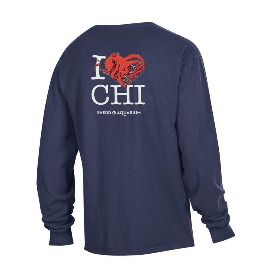 The Chicago Octo Long Sleeve T-Shirt is a navy blue shirt featuring a red octopus heart graphic and "I [octopus heart] CHI" above "Shedd Aquarium" on the back, highlighting unique marine life art.