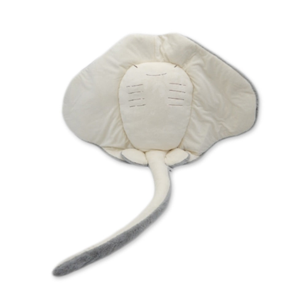 The Earth Pals 55" Jumbo Stingray is a plush toy with a soft cream body, rounded fins, long tail, and stitched face features, crafted from recycled materials and shown on a white background.