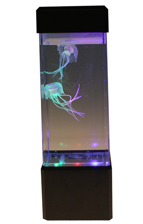 The Jellyfish Lamp is a tall rectangular tank with a black top and bottom, featuring two artificial jellyfish that float inside and are lit by color-changing LEDs at the base—an eye-catching desktop aquarium.