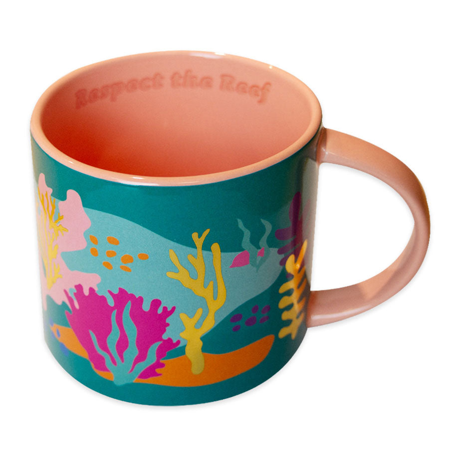 The Respect the Reef Stackable Mug features a colorful coral reef design on the outside, a pink interior, and "Respect the Reef" embossed inside the rim.