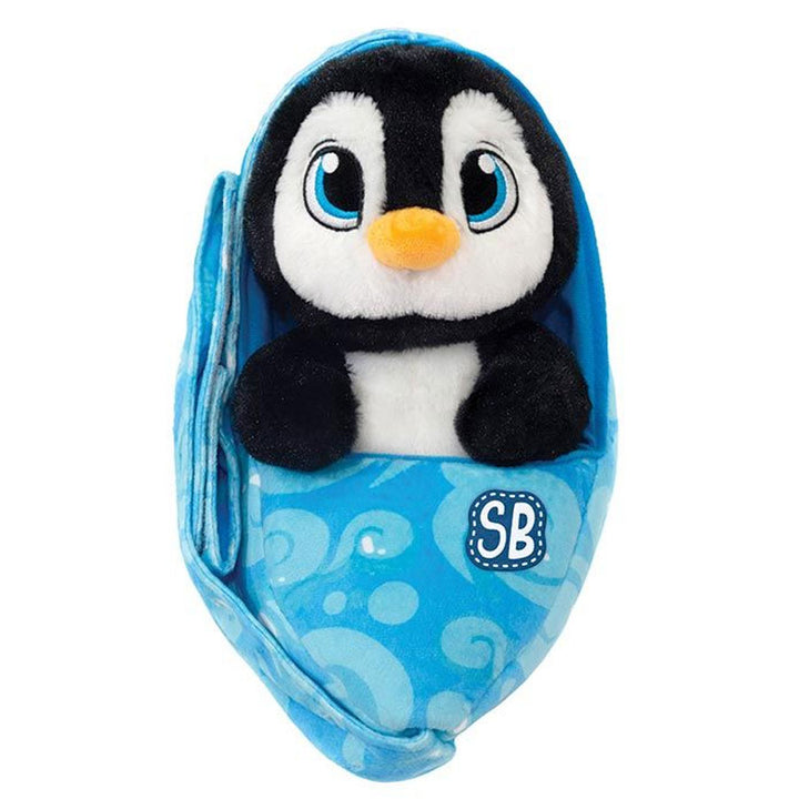 The Swaddle Babies Penguin Plush features big blue eyes and is wrapped snugly in a blue swaddle blanket with swirl designs and "SB" initials.